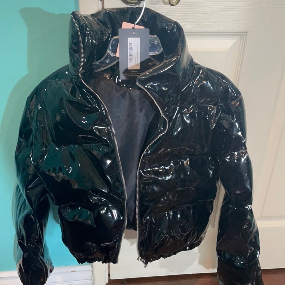 Cute black shiny puffer jacket! Never worn with tags! Size 4!!